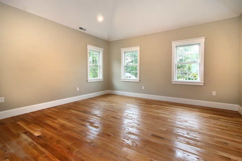 198 Overlook Road Arlington, MA 02474 - Photo 18 of 25 a view of an empty room with wooden floor and a window