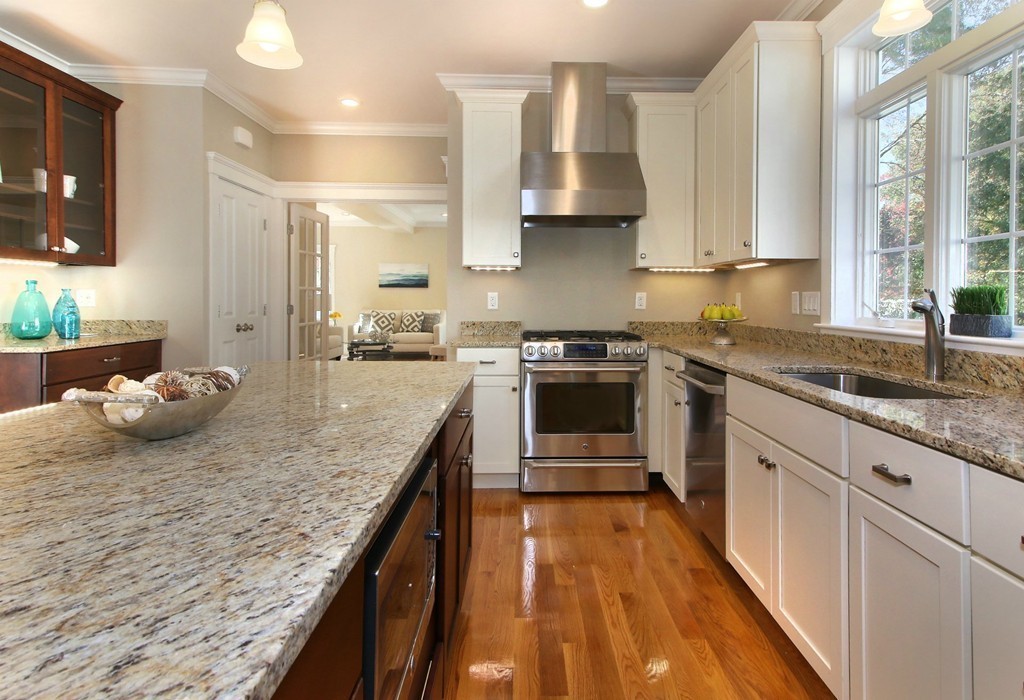 198 Overlook Road Arlington, MA 02474 - Photo 7 of 25 a kitchen with stainless steel appliances granite countertop a sink stove and refrigerator