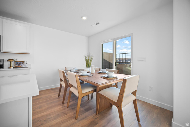 2123 Wolverine Way, Unit 2437 Washington, UT 84780 - Photo 21 of 40 Dining area featuring wood-finish flooring, recessed lighting, and a sliding glass door providing outdoor access
