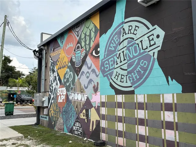a view of a brick house with many windows