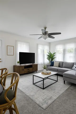 a living room with furniture and a flat screen tv