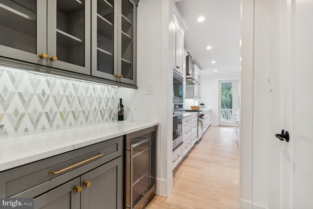 a view of a kitchen with a sink and cabinets