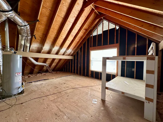 a view of staircase with a rug and a window