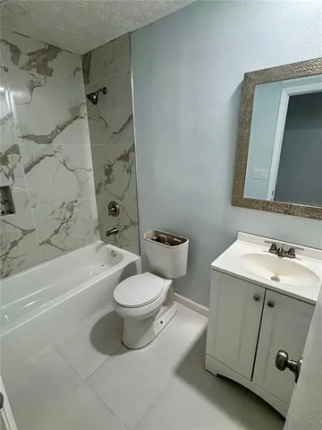a bathroom with a sink a toilet and a bathtub