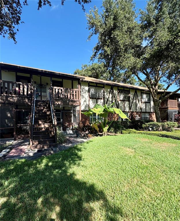 5401 Hansel Avenue, Unit 2 Orlando, FL 32809 - Photo 19 of 25 a view of a house with yard and sitting area