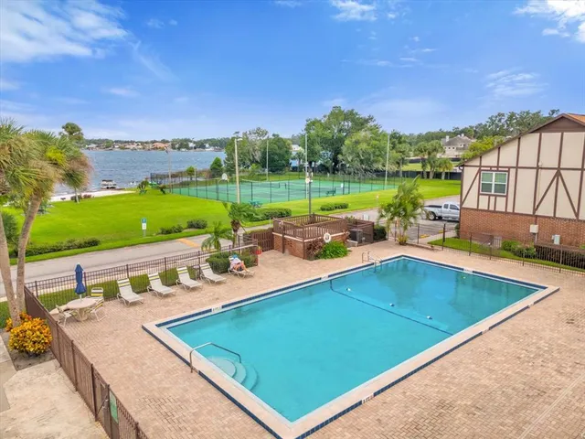 a view of a swimming pool with a patio
