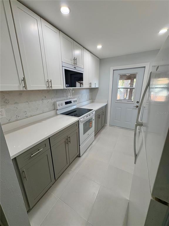 5401 Hansel Avenue, Unit 2 Orlando, FL 32809 - Photo 3 of 25 a kitchen with a sink cabinets and appliances