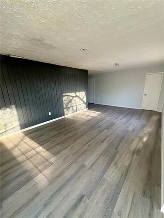 a view of a livingroom with wooden floor