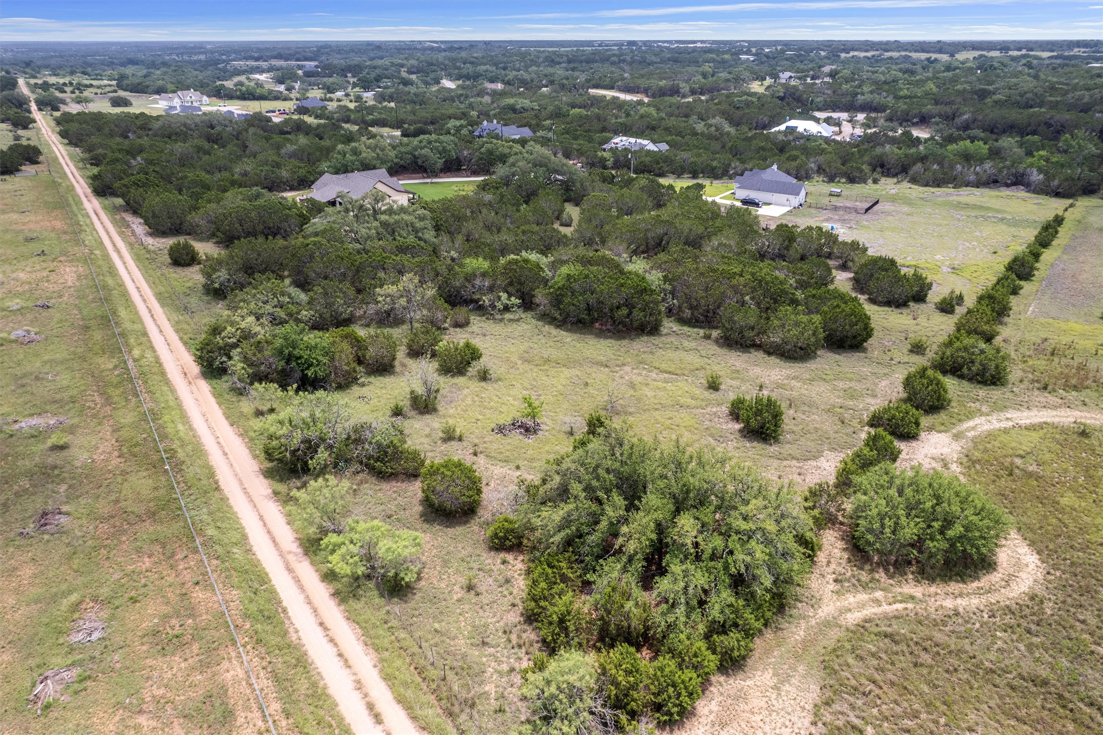 Lot 21 Rosebud Ranch Road Bertram, TX 78605 - Photo 14 of 18 an aerial view of residential houses with outdoor space