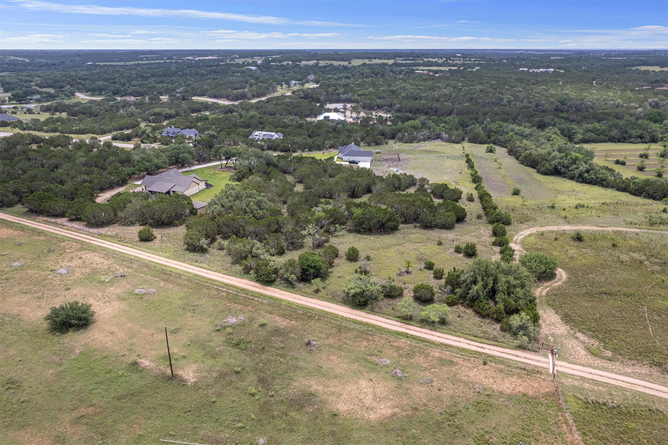 Lot 21 Rosebud Ranch Road Bertram, TX 78605 - Photo 15 of 18 an aerial view of mountain with residential house and ocean view