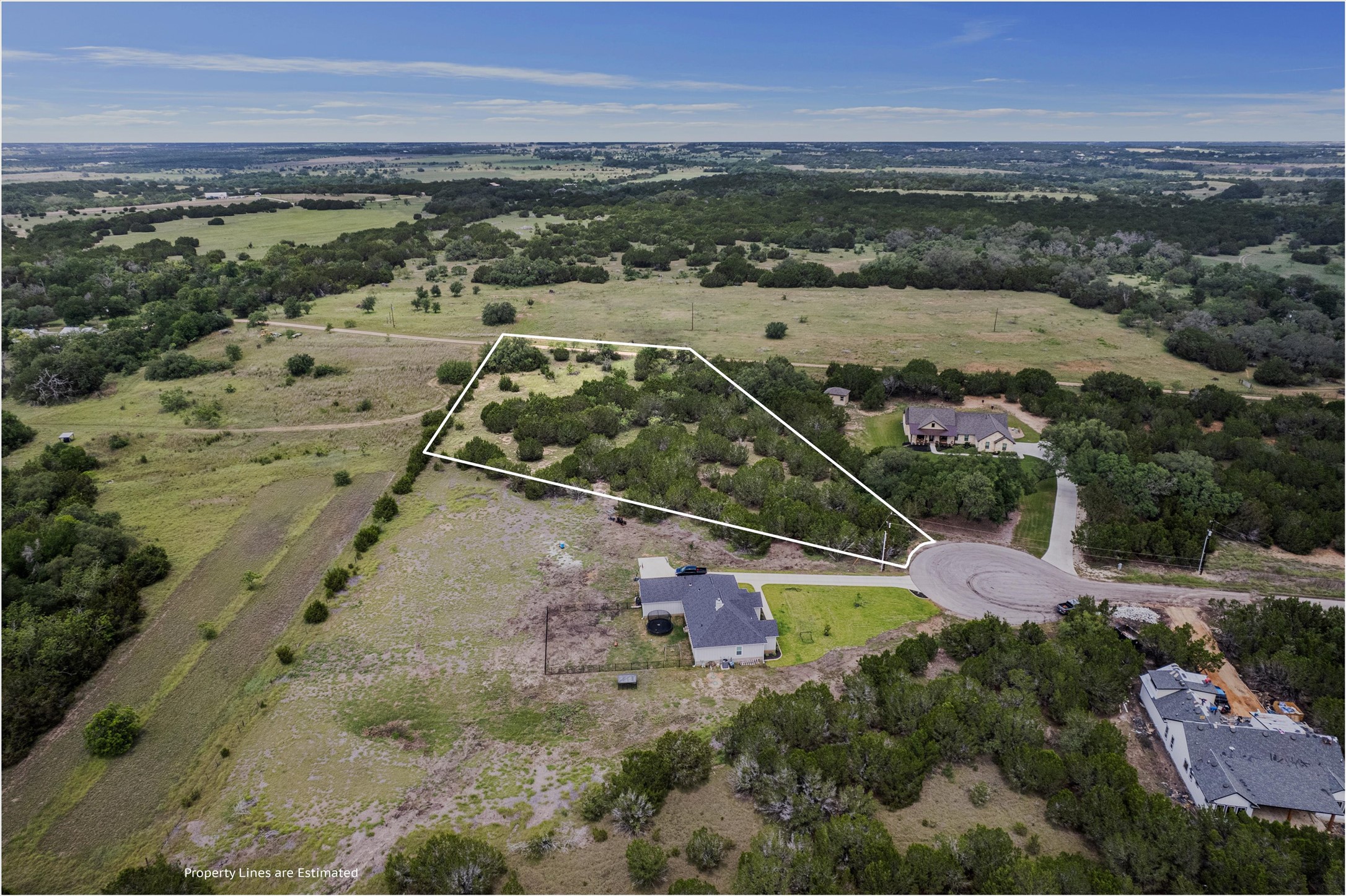Lot 21 Rosebud Ranch Road Bertram, TX 78605 - Photo 5 of 18 an aerial view of ocean and residential houses with outdoor space