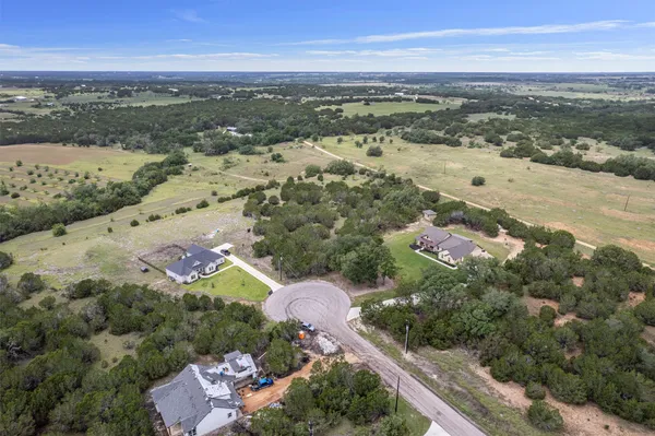 an aerial view of a houses with outdoor space