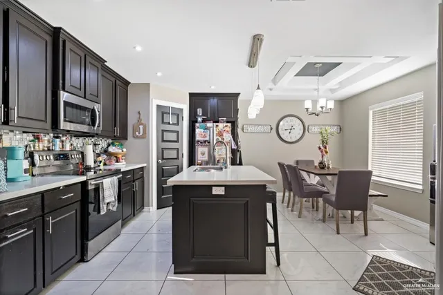 a kitchen with stainless steel appliances granite countertop a sink and cabinets