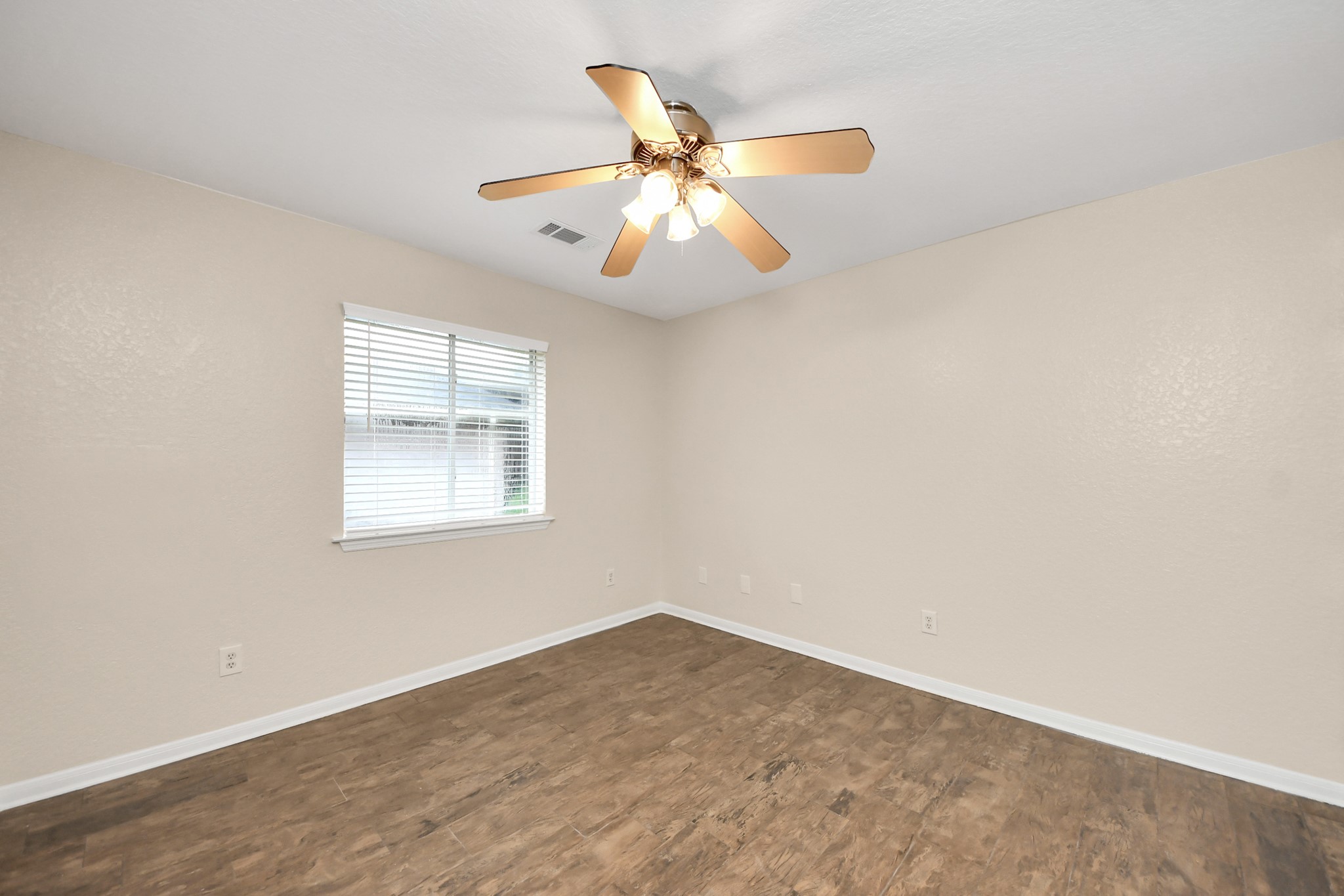 14610 Hazy Ridge Lane Cypress, TX 77429 - Photo 30 of 44 Bedroom 2 features a spacious walk-in closet and beautiful wood flooring, continuing the home's elegant flooring throughout for a seamless and stylish look.