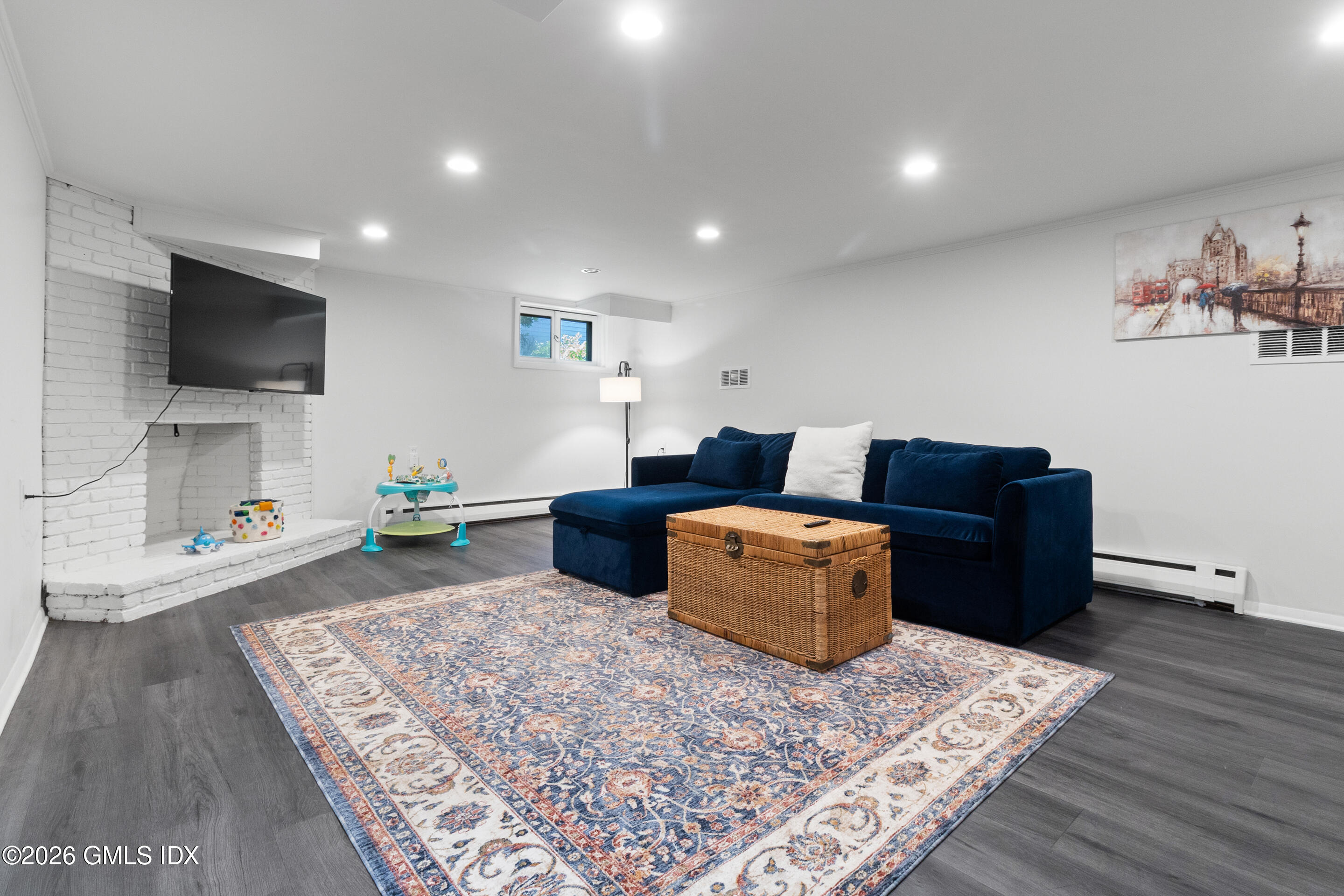 9 Deluca Drive Cos Cob, CT 06807 - Photo 21 of 30 a living room with furniture and a flat screen tv