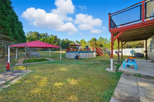 a view of a park with swings and a table