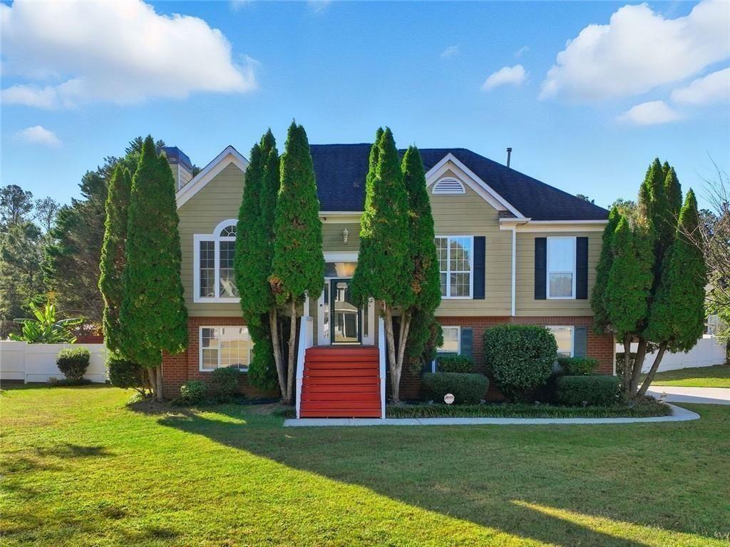 147 Midland Drive Stockbridge, GA 30281 - Photo 27 of 30 a front view of a house with a yard and trees
