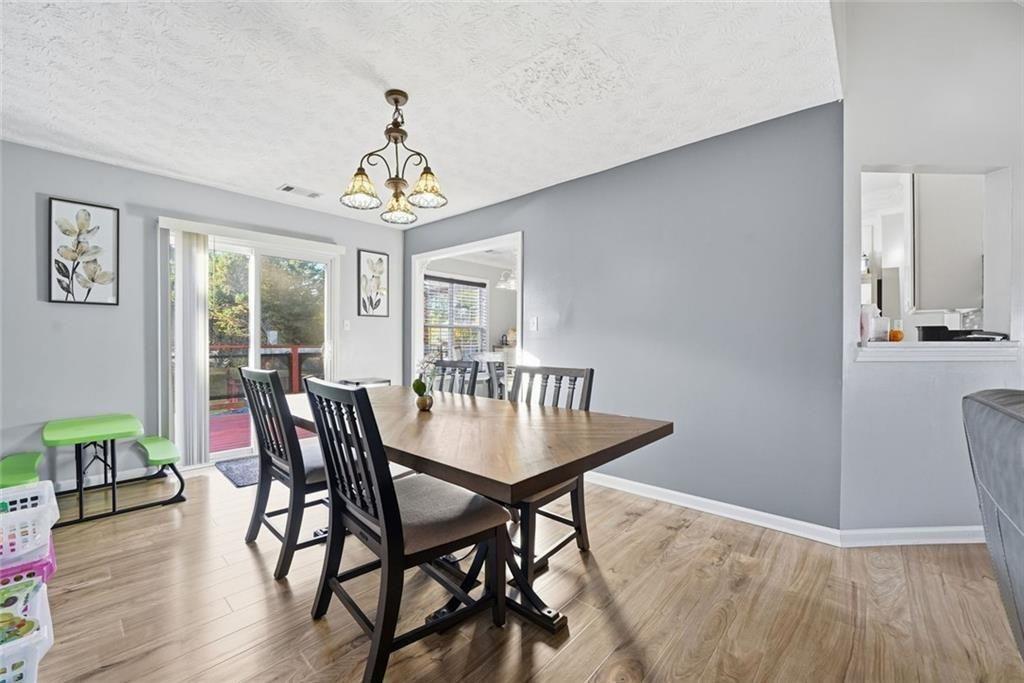147 Midland Drive Stockbridge, GA 30281 - Photo 5 of 30 a view of a dining room with furniture window and wooden floor