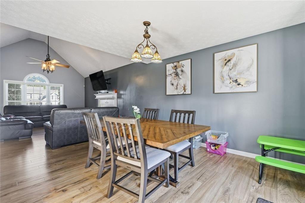 147 Midland Drive Stockbridge, GA 30281 - Photo 6 of 30 a view of a dining room with furniture window and wooden floor