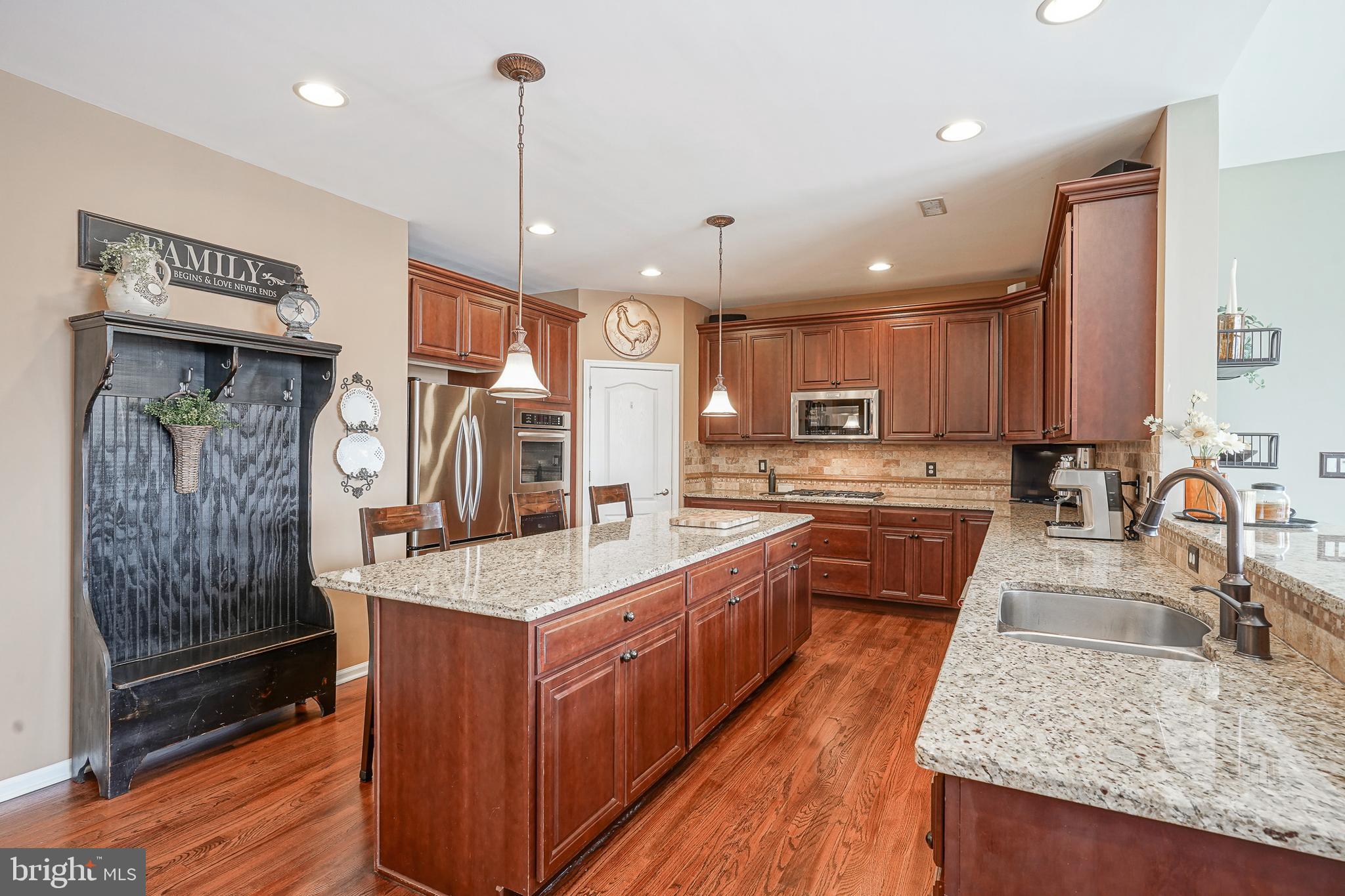 804 Chelsea Glenn Road Clarksboro, NJ 08020 - Photo 13 of 58 a large kitchen with stainless steel appliances granite countertop plenty wooden cabinets counter space a sink and wooden floor