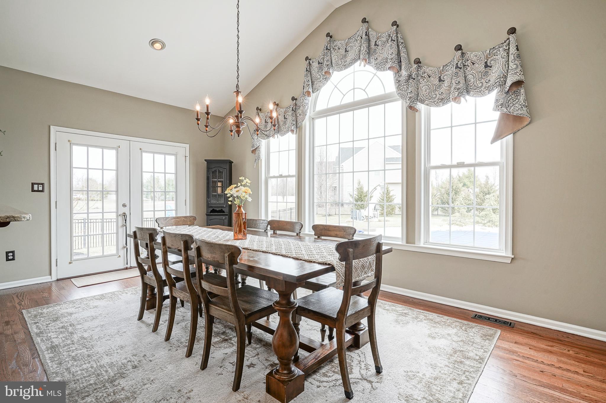 804 Chelsea Glenn Road Clarksboro, NJ 08020 - Photo 16 of 58 a view of a dining room with furniture wooden floor and chandelier