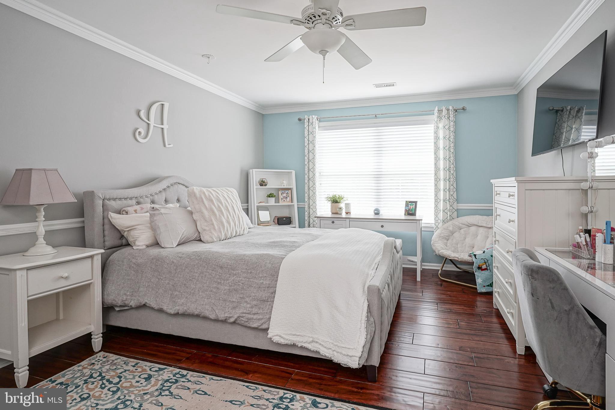 804 Chelsea Glenn Road Clarksboro, NJ 08020 - Photo 34 of 58 a bedroom with a large bed and a chandelier