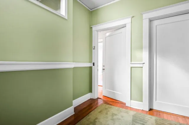 a view of entryway with wooden floor