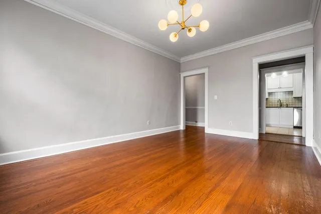 a kitchen with stainless steel appliances granite countertop a refrigerator sink and stove