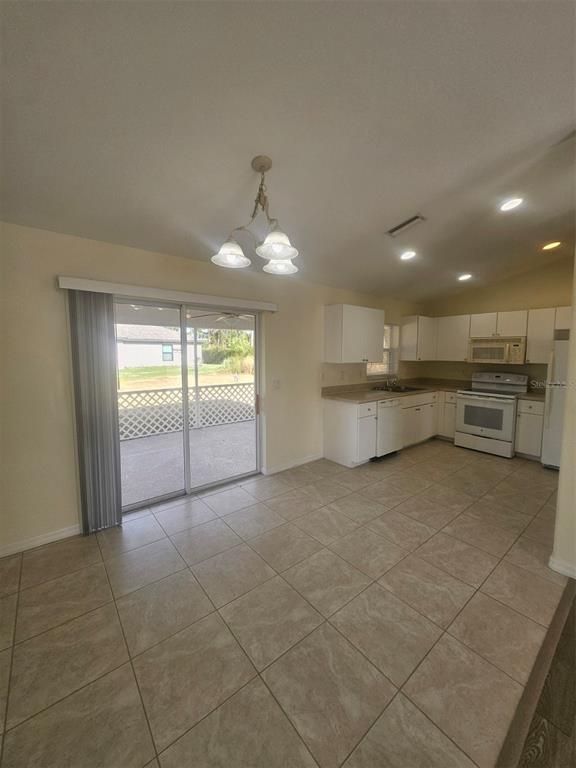 7450 Blutter Road North Port, FL 34291 - Photo 14 of 34 a view of a kitchen with a sink and a window