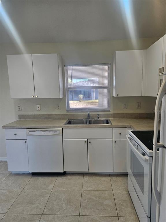 7450 Blutter Road North Port, FL 34291 - Photo 16 of 34 a kitchen with cabinets appliances a sink and a counter top