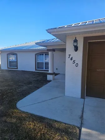 a front view of a house with yard