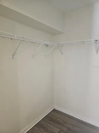 a view of an empty walk in closet