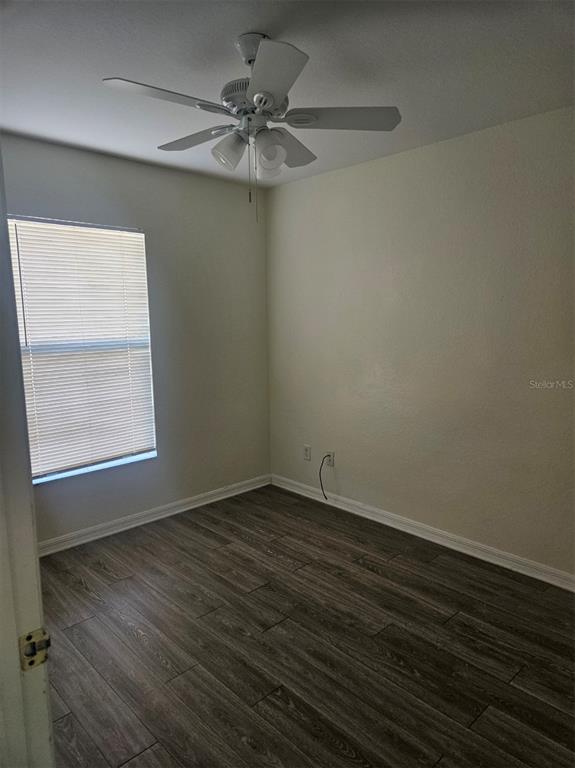 7450 Blutter Road North Port, FL 34291 - Photo 30 of 34 an empty room with wooden floor and windows