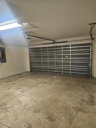 a view of an empty room with a storage