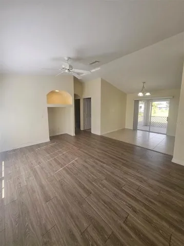 a view of a room and wooden floor