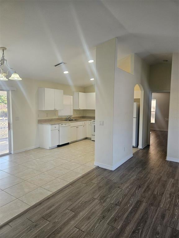 7450 Blutter Road North Port, FL 34291 - Photo 5 of 34 a view of kitchen with wooden floor