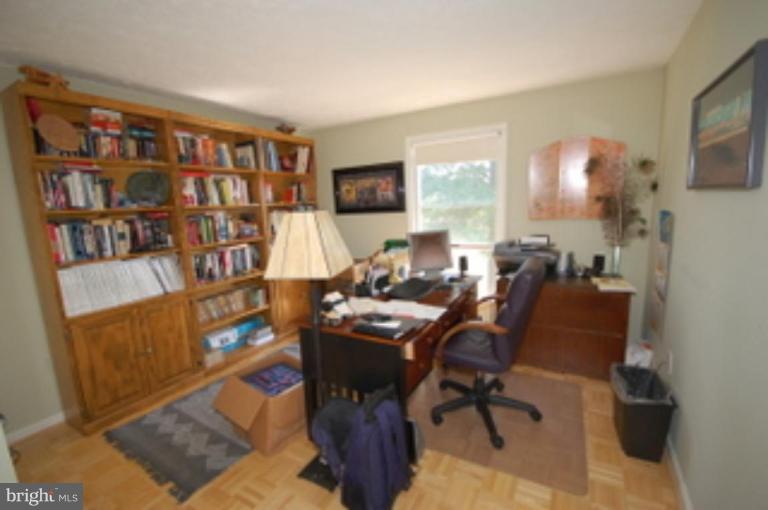 14143 Taylorstown Road Leesburg, VA 20176 - Photo 11 of 15 a view of a workspace with furniture and a window