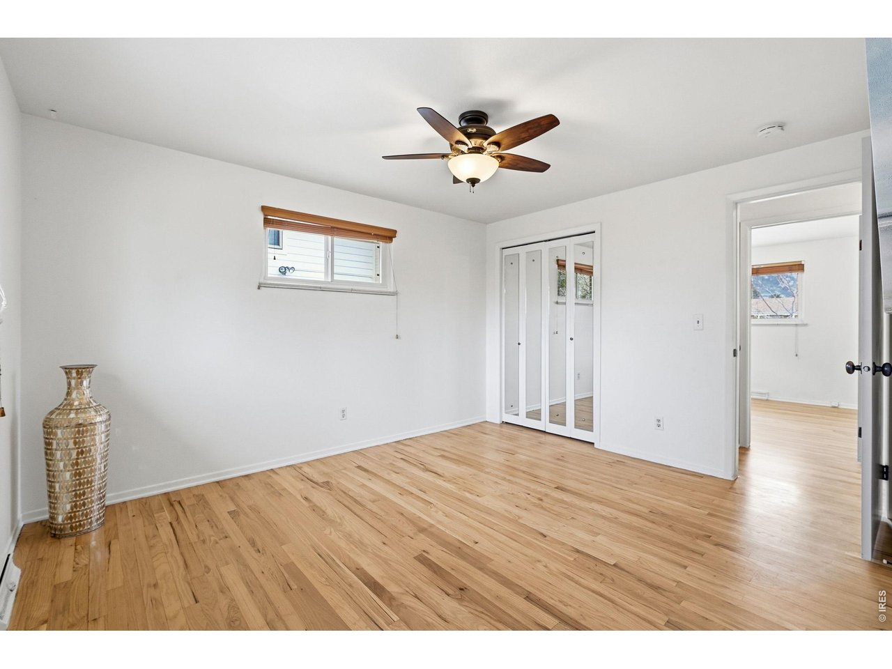 130 Cherokee Way Boulder, CO 80303 - Photo 10 of 25 a view of an empty room with wooden floor