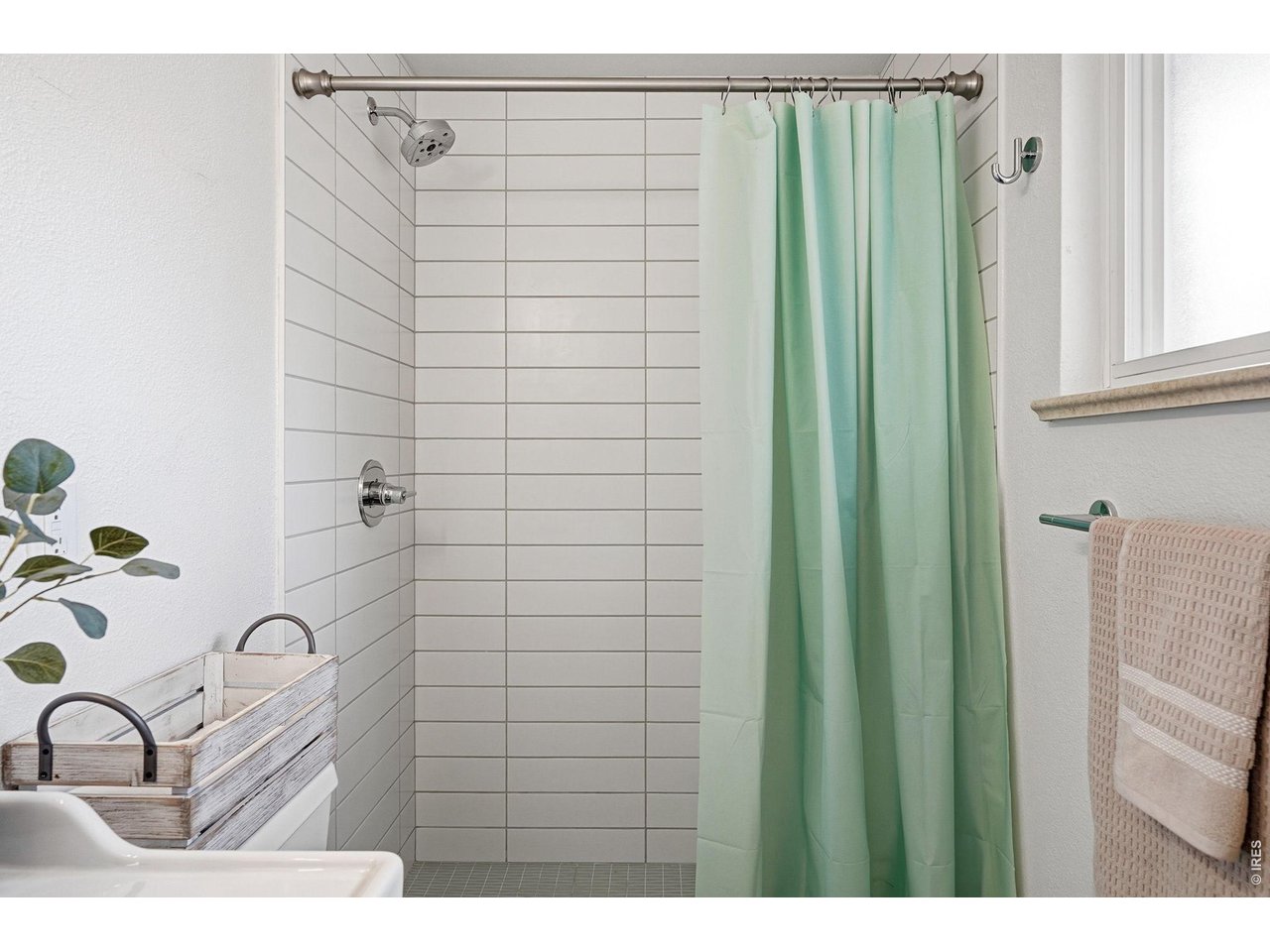 130 Cherokee Way Boulder, CO 80303 - Photo 13 of 25 a bathroom with a shower curtain and a sink