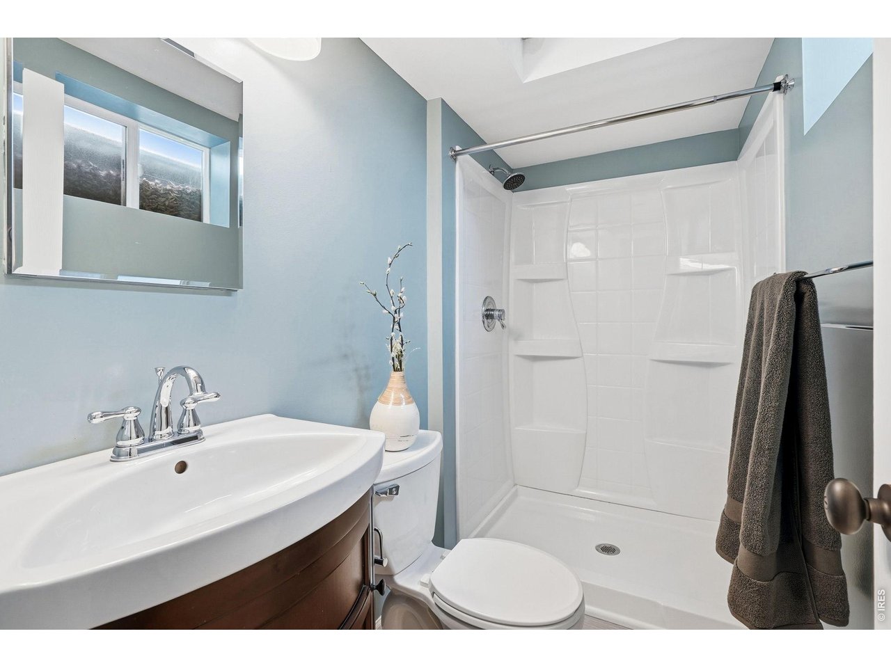 130 Cherokee Way Boulder, CO 80303 - Photo 21 of 25 a bathroom with a sink toilet a mirror and shower