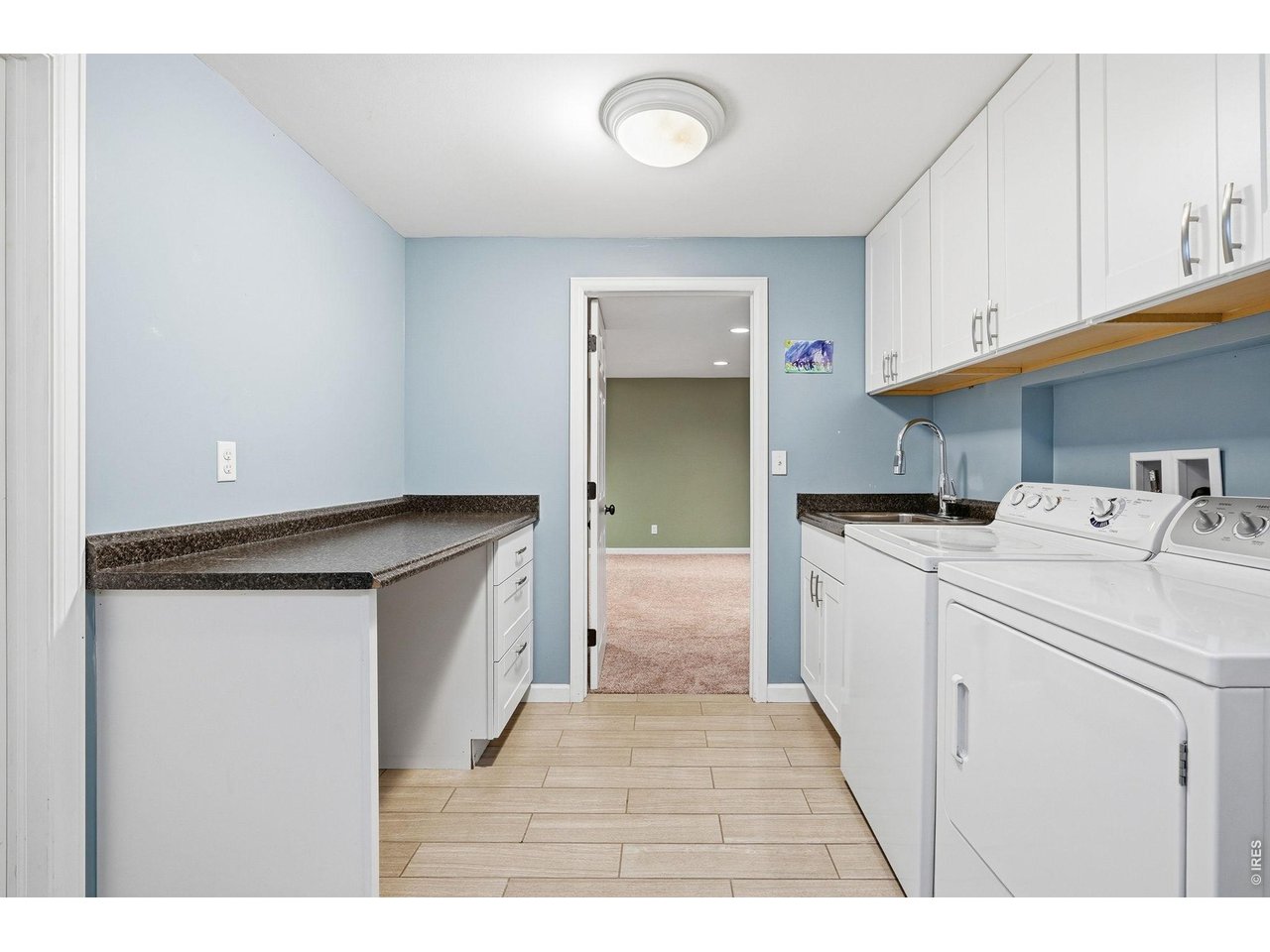130 Cherokee Way Boulder, CO 80303 - Photo 22 of 25 a kitchen with a sink a stove and cabinets