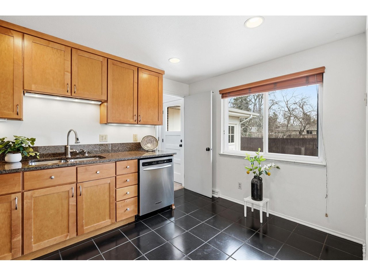 130 Cherokee Way Boulder, CO 80303 - Photo 8 of 25 a kitchen with a sink cabinets and window