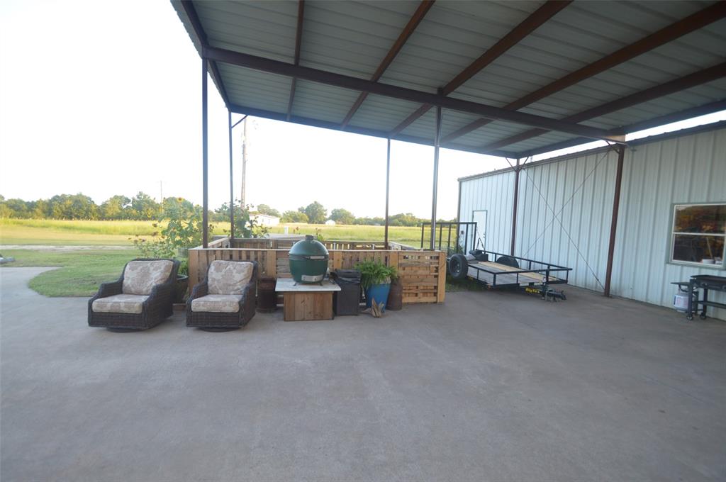 261 Red Road Howe, TX 75459 - Photo 12 of 37 a view of a terrace with lawn chairs