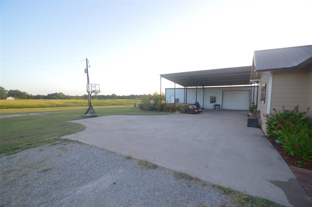 261 Red Road Howe, TX 75459 - Photo 15 of 37 a view of an house with a yard and a large parking space