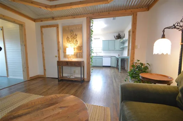 a bedroom with furniture and a large window