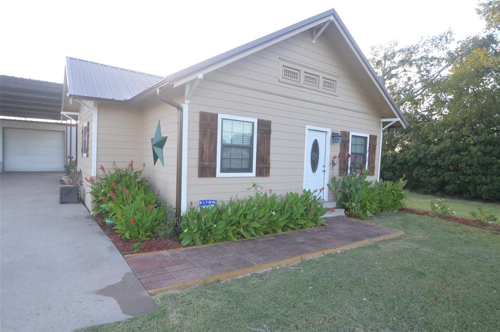 261 Red Road Howe, TX 75459 - Photo 3 of 37 a front view of a house with garden