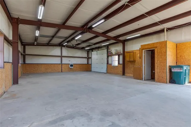 a view of empty room with wooden ceiling