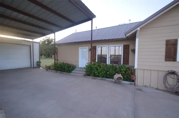 a view of a house with a patio
