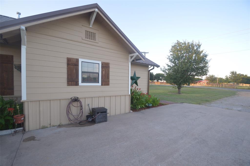 261 Red Road Howe, TX 75459 - Photo 6 of 37 a front view of a house with garden