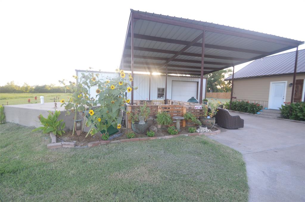 261 Red Road Howe, TX 75459 - Photo 8 of 37 a view of a chairs and table in the patio
